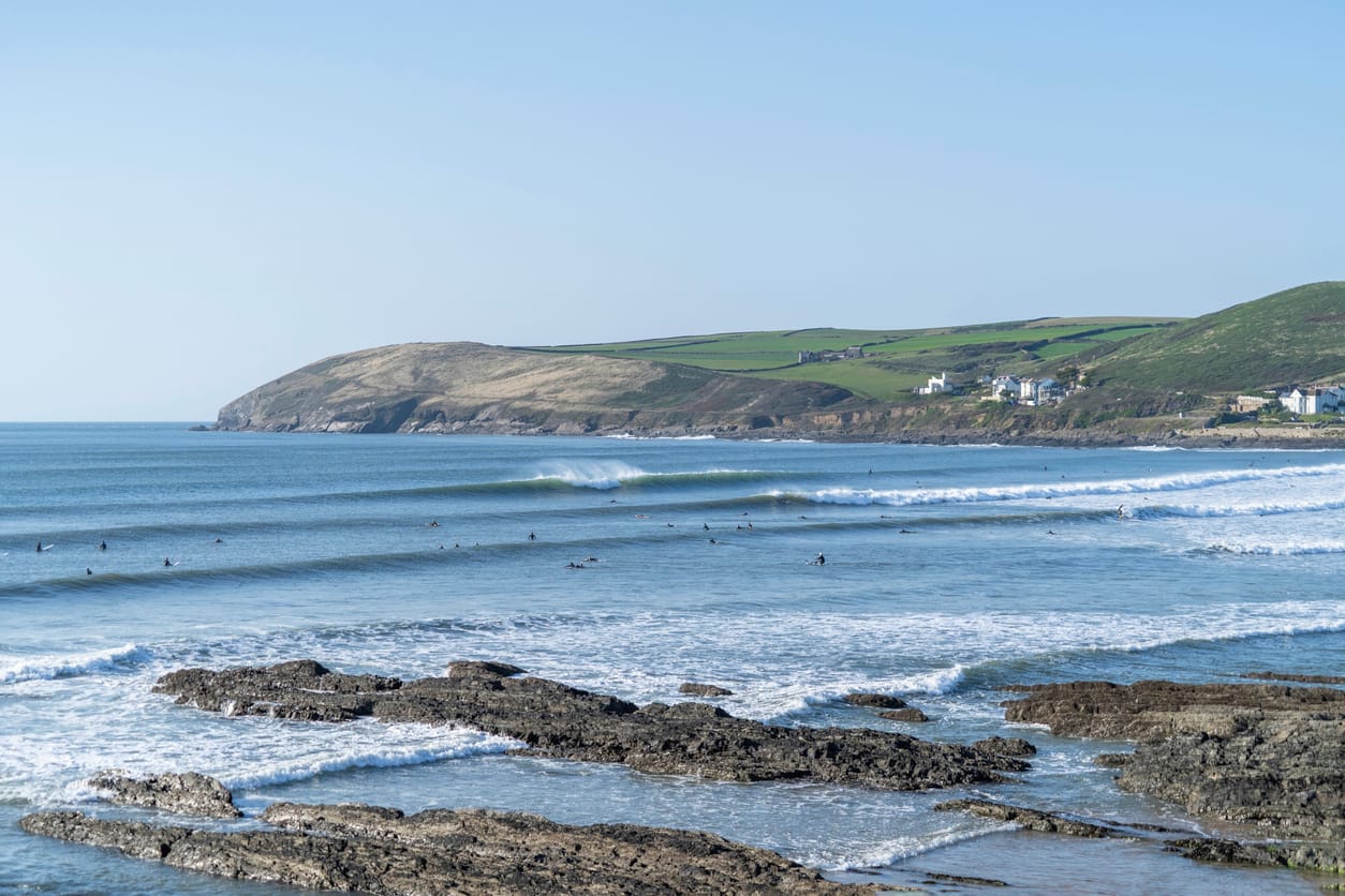 Surfers at Croyde Beach in Devon