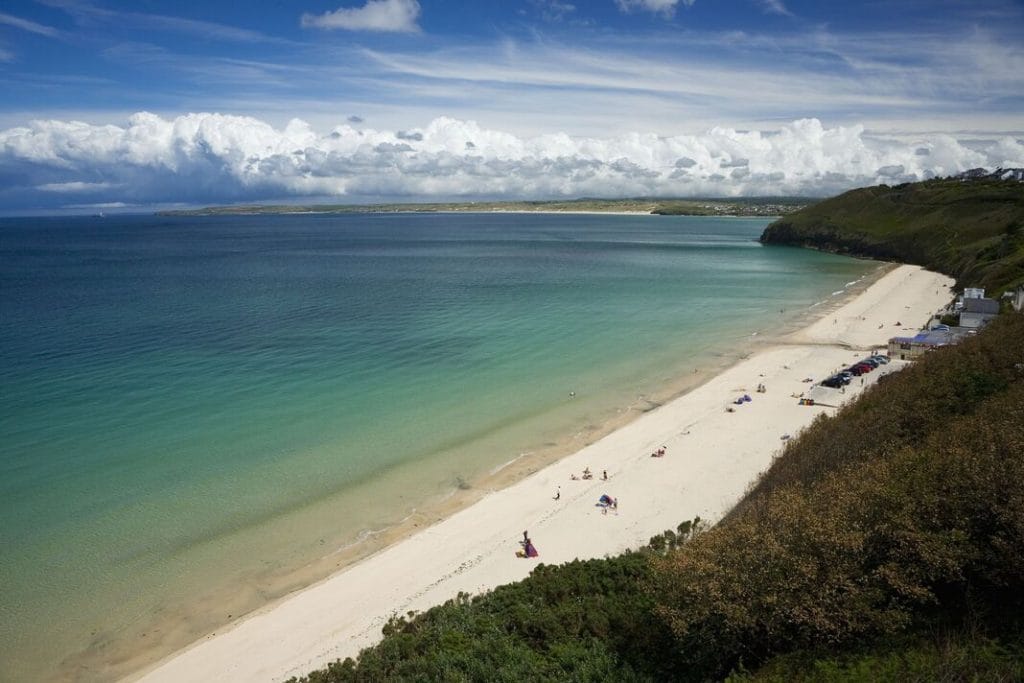 Carbis Bay’s crescent beach with calm turquoise winter water and sandy beach