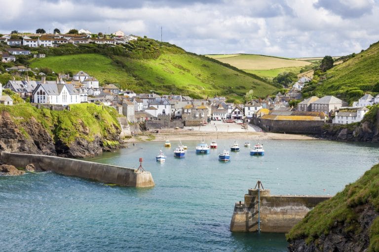 Winter sunlight over a quiet Cornish beach with gentle waves and empty sands