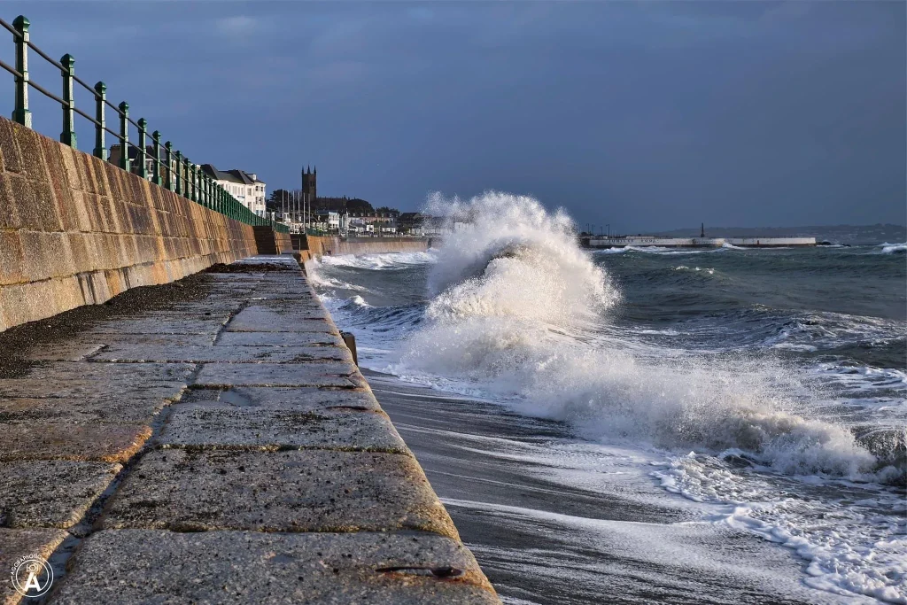 The waves crashing on the promenade in Penzance, Cornwall