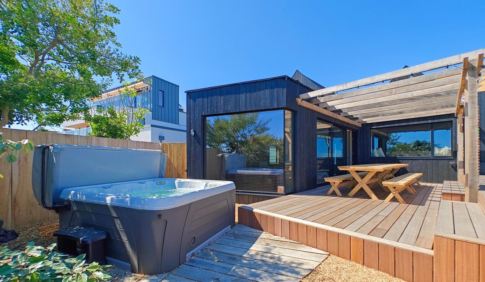 Dog friendly holiday home with a private hot tub and sea views.