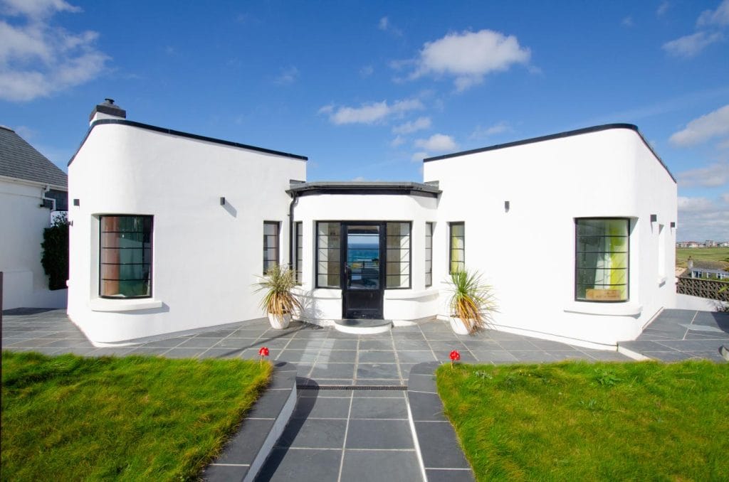 Large and stylish Art Deco holiday home sleeping 10 with sea views over Fistral Beach.