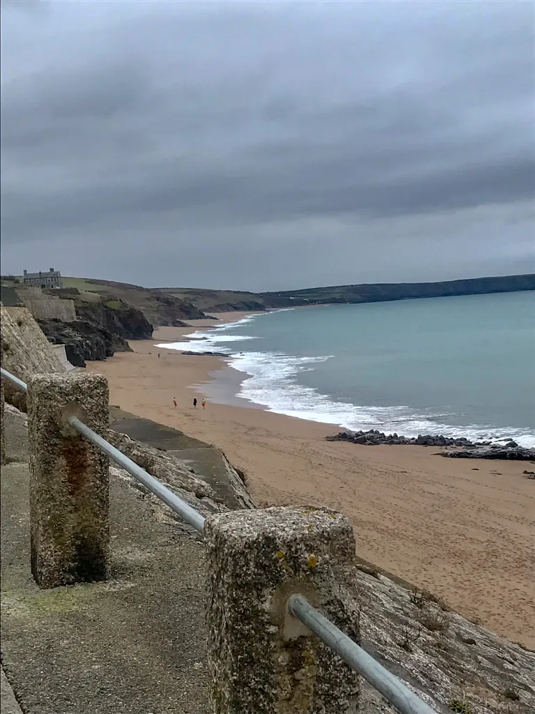 Porthleven beach on a calm winter day with empty sands