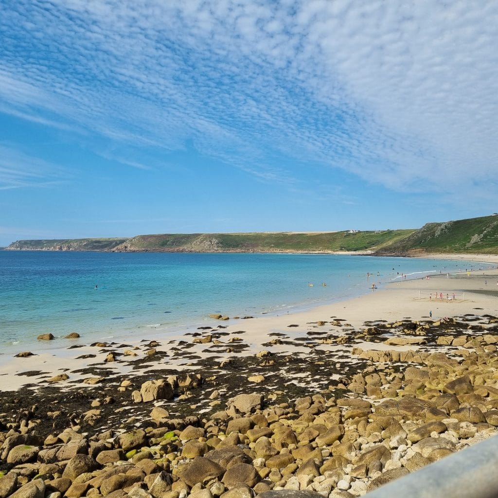 Sennen Cove Cornwall – golden beach with Atlantic surf and cliffs.
