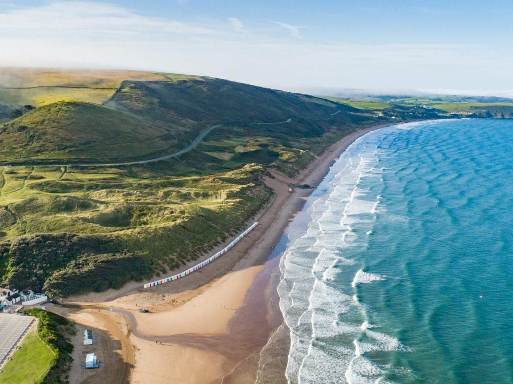 Aerial view of the long, family friendly sandy beach at Woolacombe.
