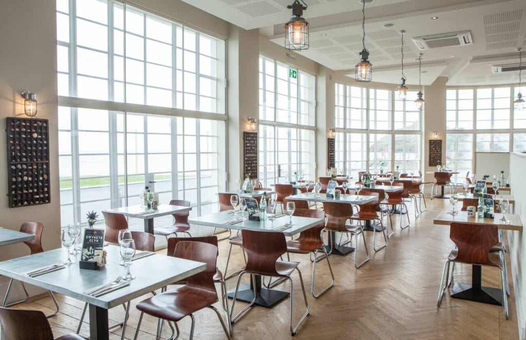 Light filled dining area at Dylans restaurant in Criccieth