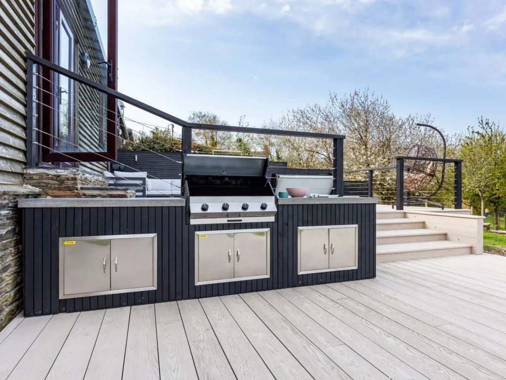 Outdoor deck and BBQ are of large holiday home in Woolacombe