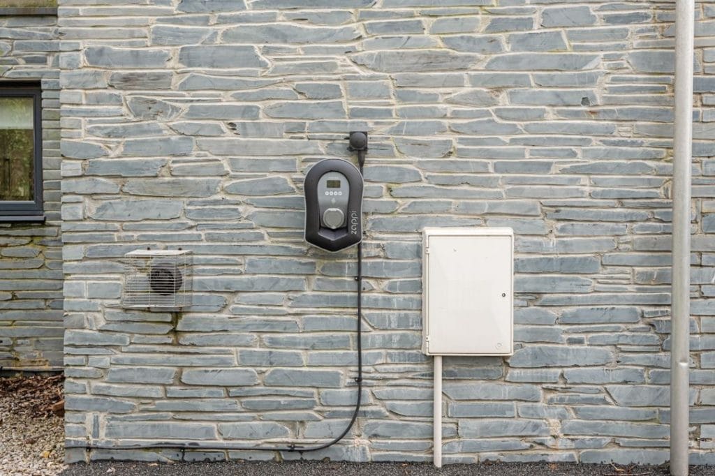 EV charging point on the stone wall