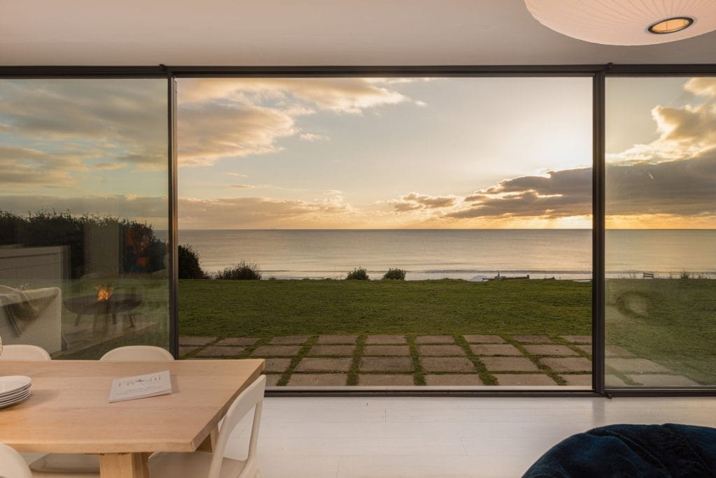 Looking out at the sea and sunset from the living area