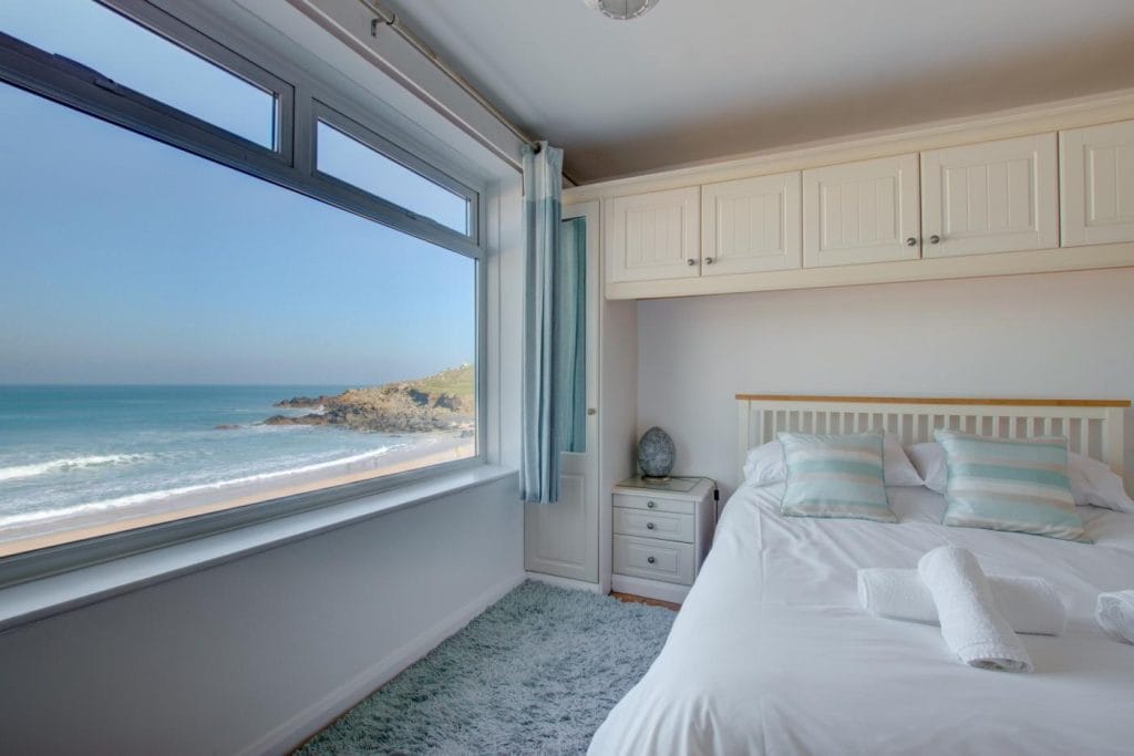 Master bedroom with sea views from St Ives beachfront apartment