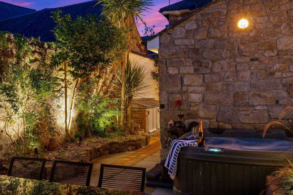 Seaside hot tub in the evening under lights
