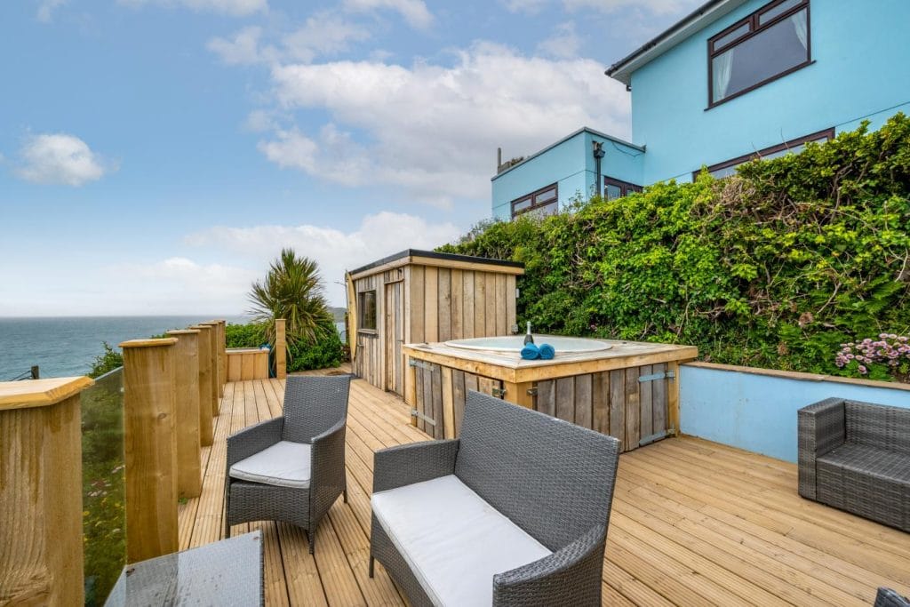 Large holiday home with a private hot tub by the sea