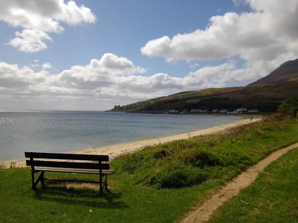 Wooden bench overlooking Sannox Bay in North Ayrshire
