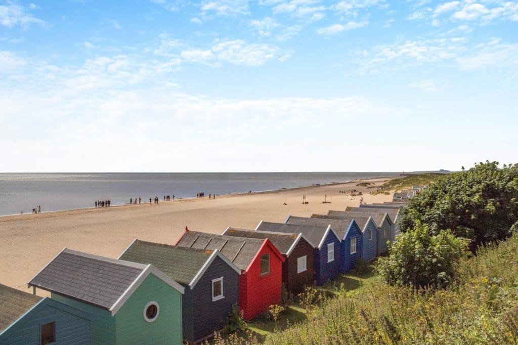 View from behind the colourful huts lining Southwold Beach