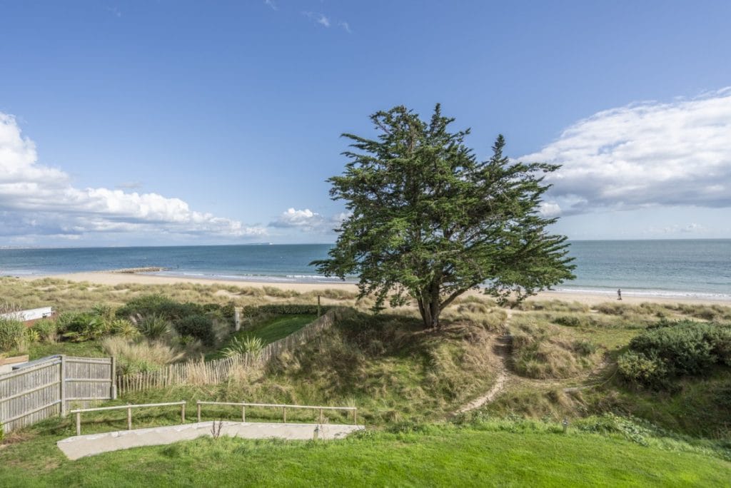 View through the dunes at Sandbanks Beach in Dorset