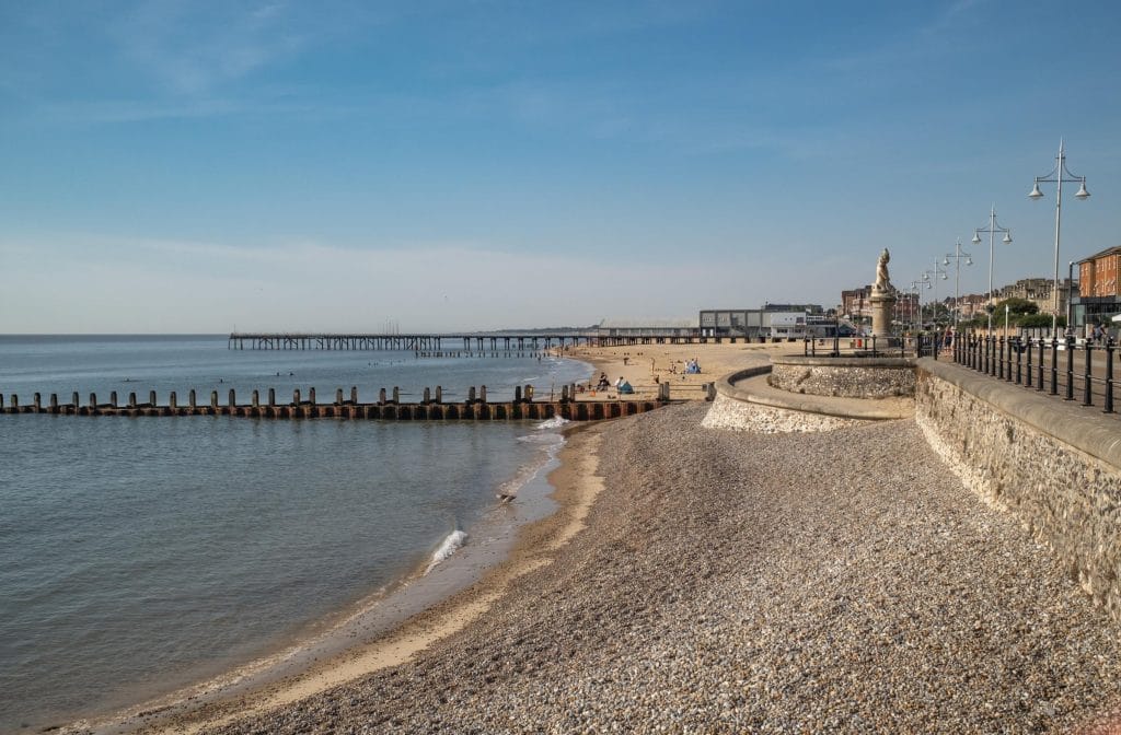Side view of Lowestoft beach showing wooden groynes