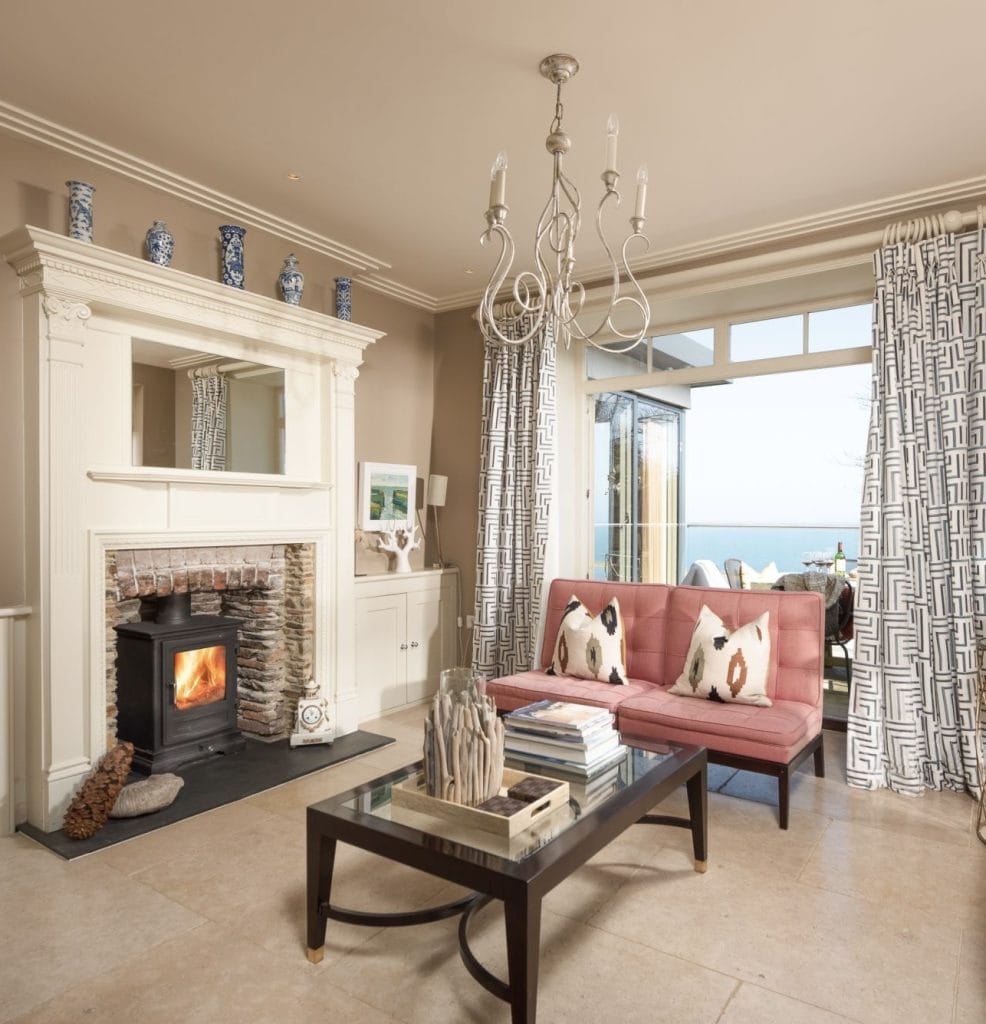 Living room with a log burner and sea views in Torcross, Devon