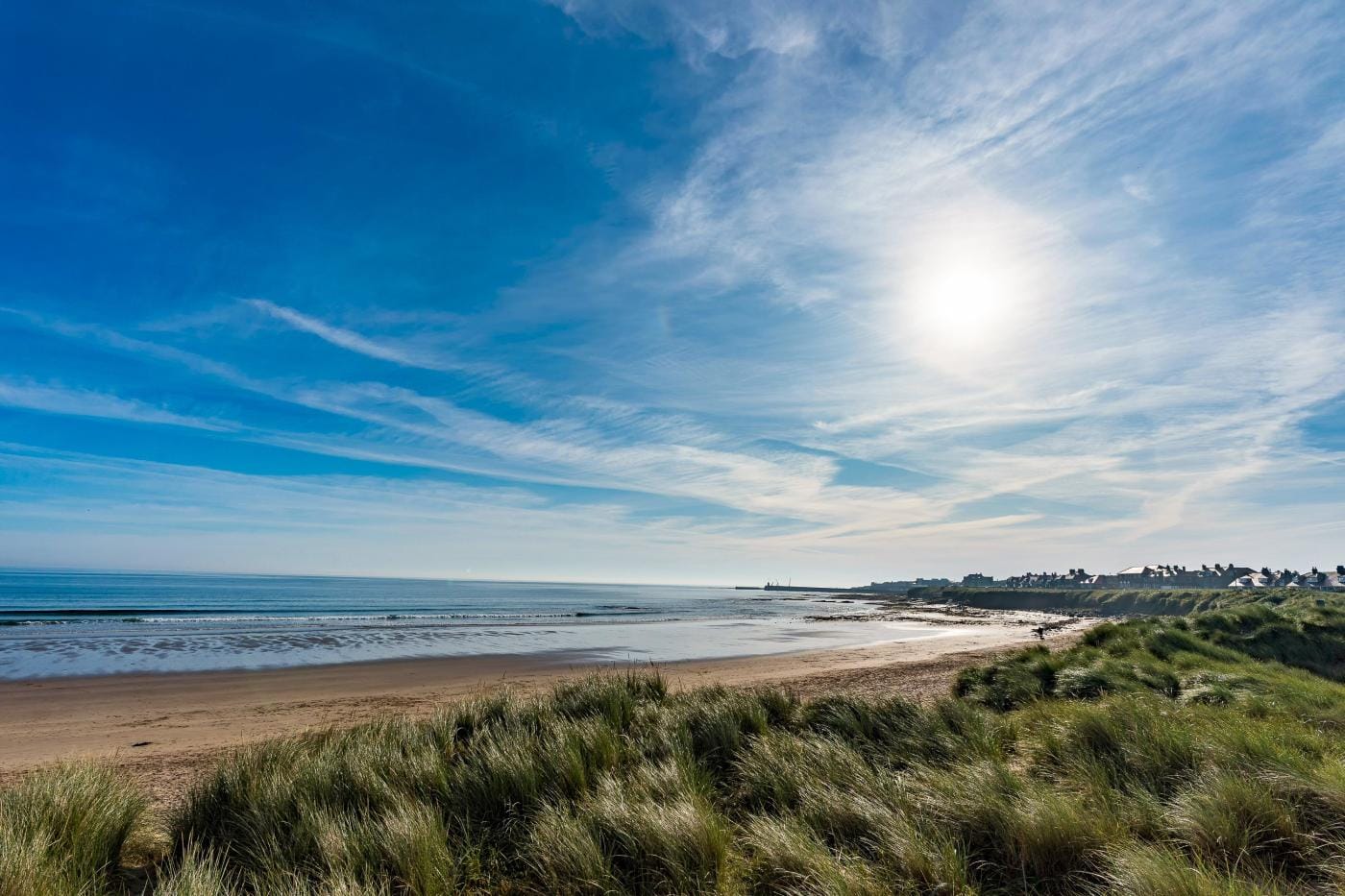 Late afternoon view across the sandy beach at Seahouses in Northumberland
