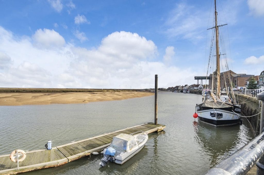 Boats moored in the marina at Wells-next-the-Sea