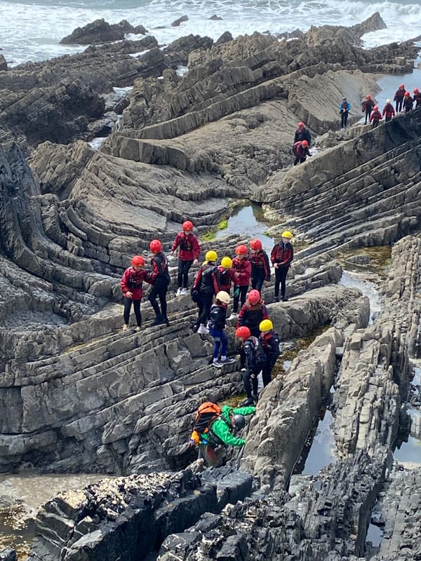 A group coasteering in Hartland, Devon