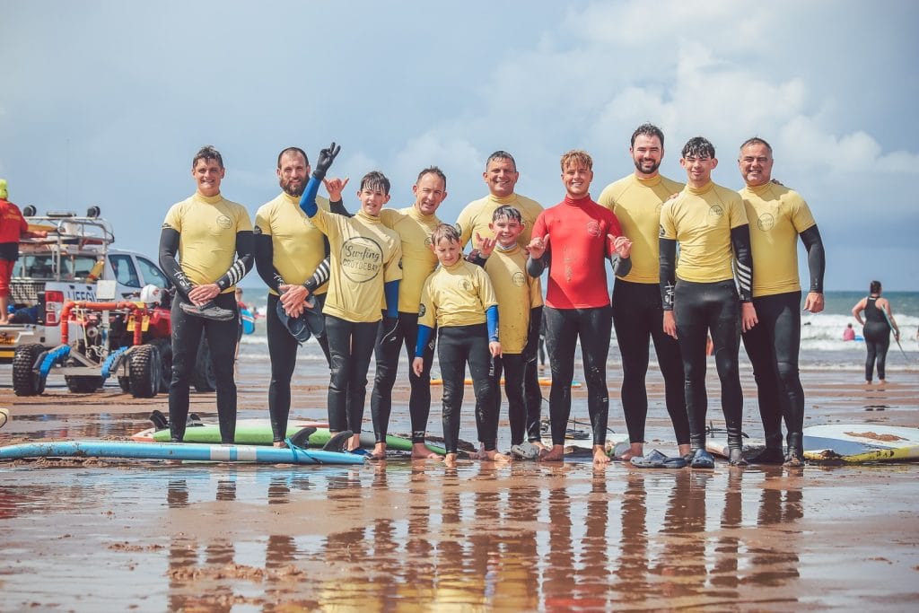 Group of beginners learning to surf at Croyde Bay