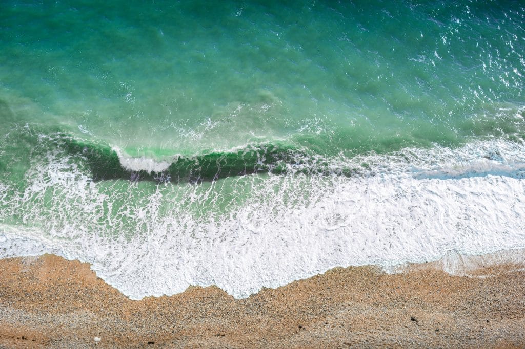 Aerial view of turquoise sea water on the beach at Eastbourne, Sussex