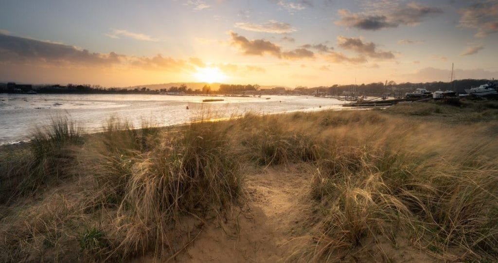 Looking across the sand dunes at St Helens Beach at sunset