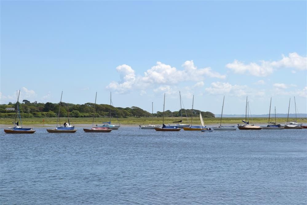 Sailing boats bobbing in the water at Lymington, Hampshire