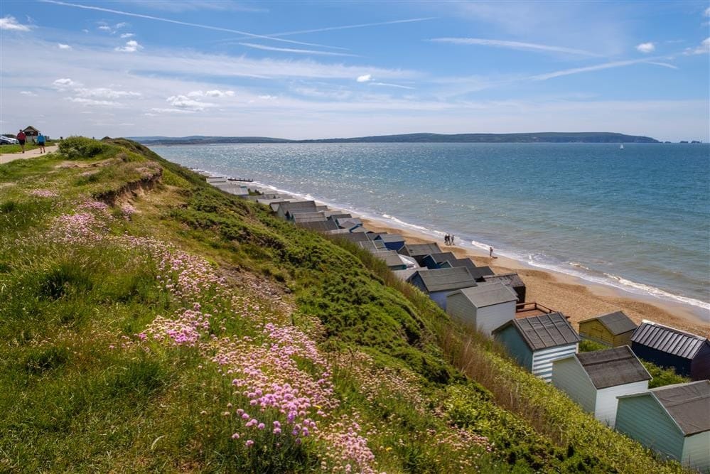 Beach huts lining the shore at Milford-on-Sea, Hampshire