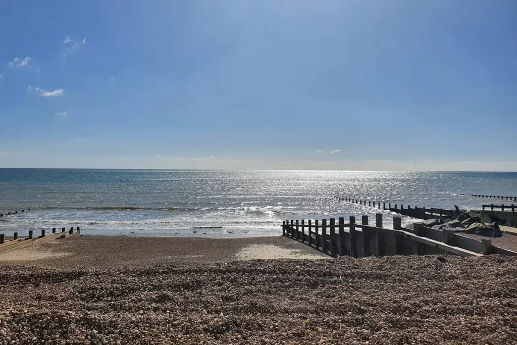 Wooden groynes on the sand and shingle beach at Bognor Regis, West Sussex