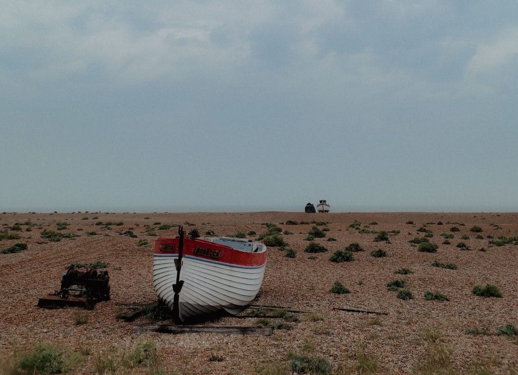A boat sitting on the gravel beach at Dungeness on the Kent coast.