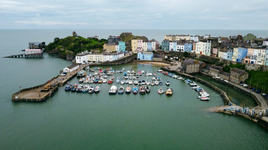 Tenby Harbour filled with boats on a cloudy day.