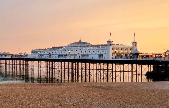 Brighton pier with an orange sky at sunset