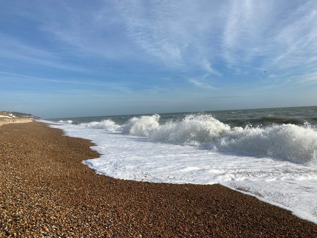 Waves coming in on a pebbly beach in Kent, England