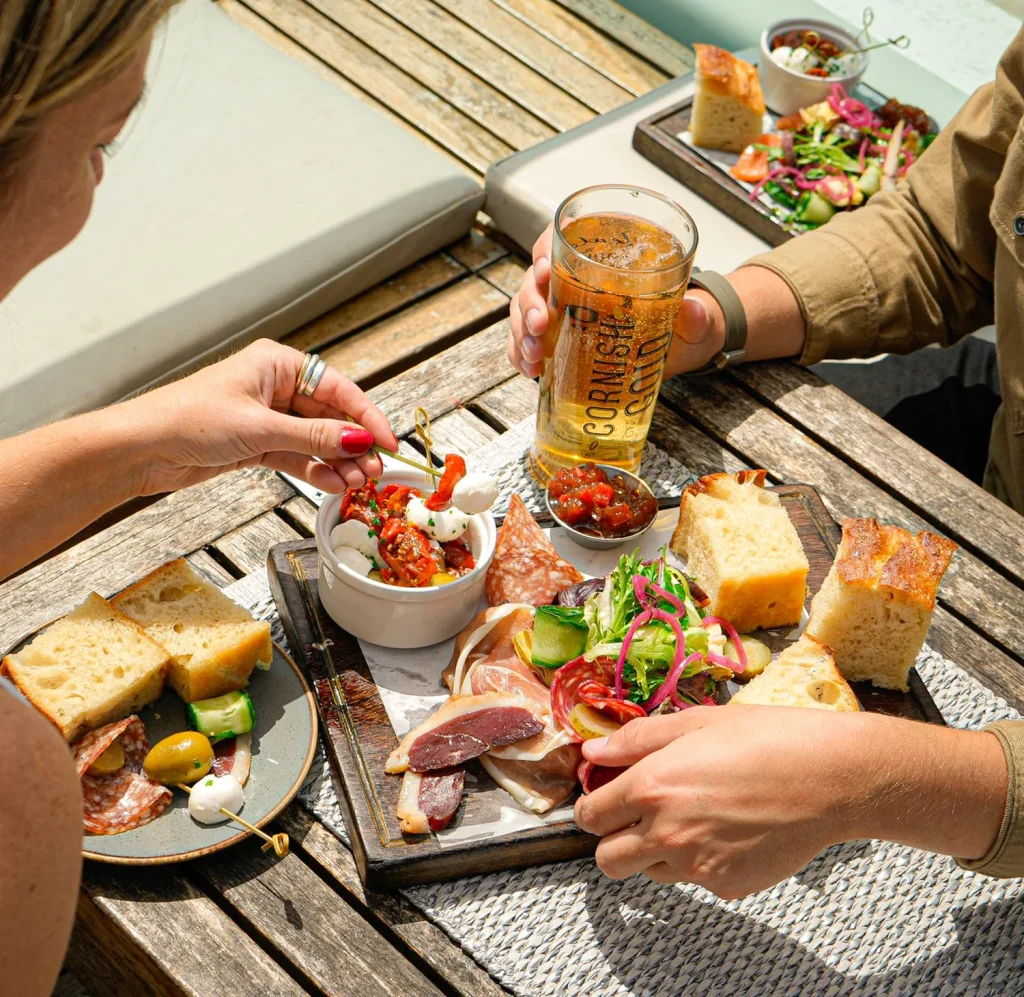 Mixed plate of cheese, salad and ham at Gylly Beach Cafe in Falmouth, Cornwall.
