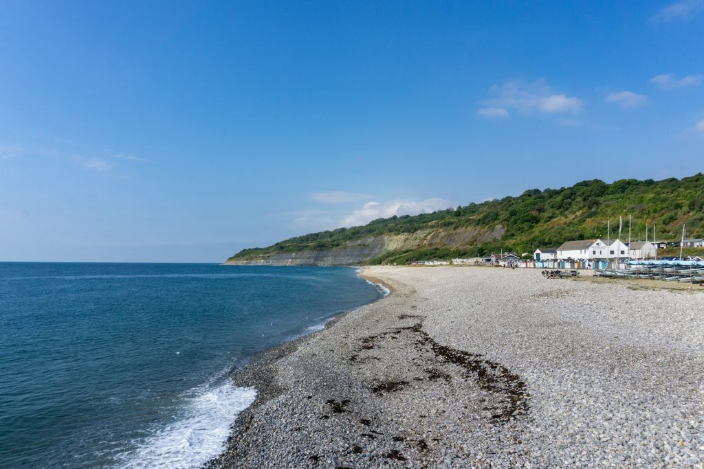 Scenic view of cliffs and shingle beach at Lyme Regis, Jurassic Coast, Dorset.