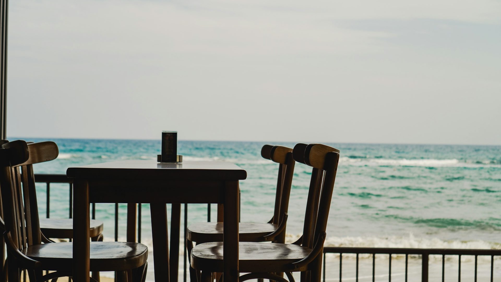 Cornwall restaurant with table for four by the beach with sea views.