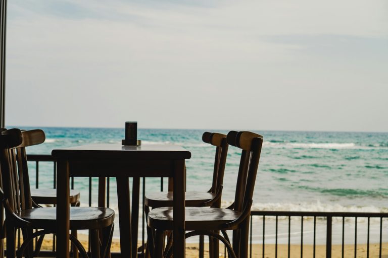 Cornwall restaurant with table for four by the beach with sea views.