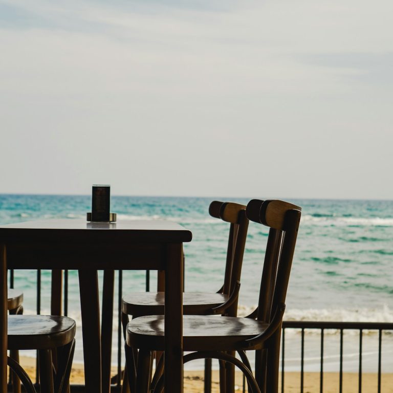 Cornwall restaurant with table for four by the beach with sea views.