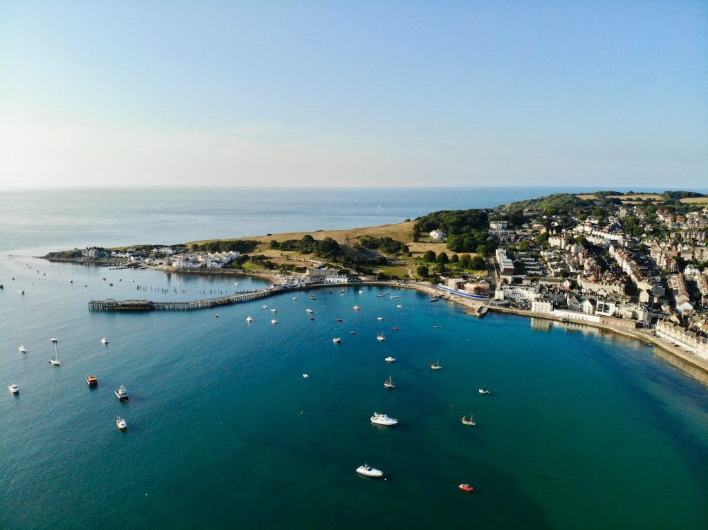 Picturesque harbour full of boats in Swanage, Dorset on a sunny day.