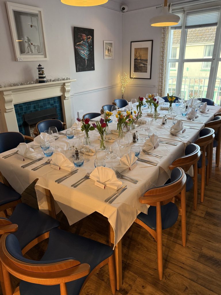 Large group dining table at the Lighthouse Restaurant Aldeburgh, Suffolk.