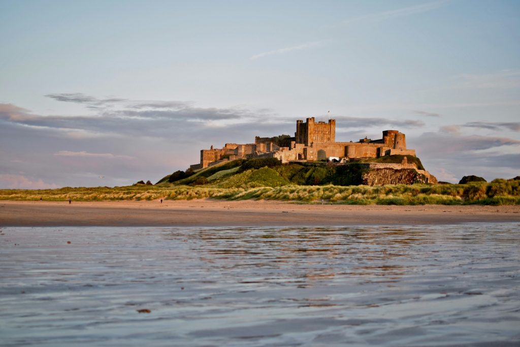 View of Bamburgh Castle from the sea during a summer's day.