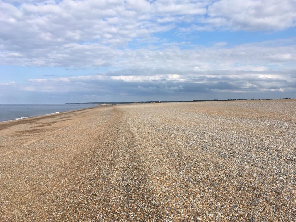 Looking along the wide shingle beach at Cley-next-the-Sea.