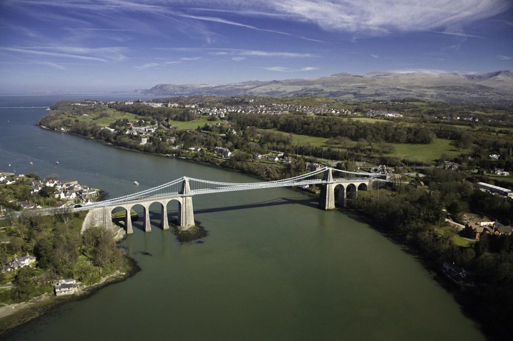 Aerial view of the Menai Suspension Bridge in Anglesey, North Wales, UK.