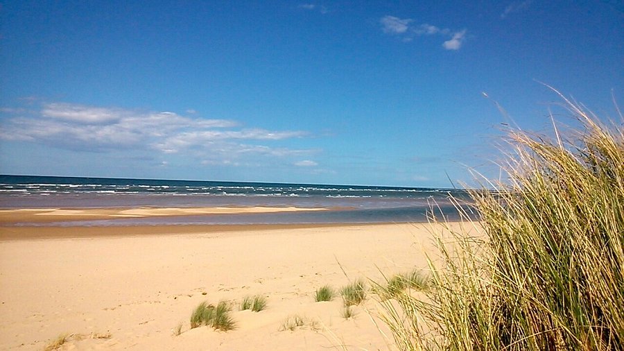 View from the dunes of Holkham Beach on a sunny day.