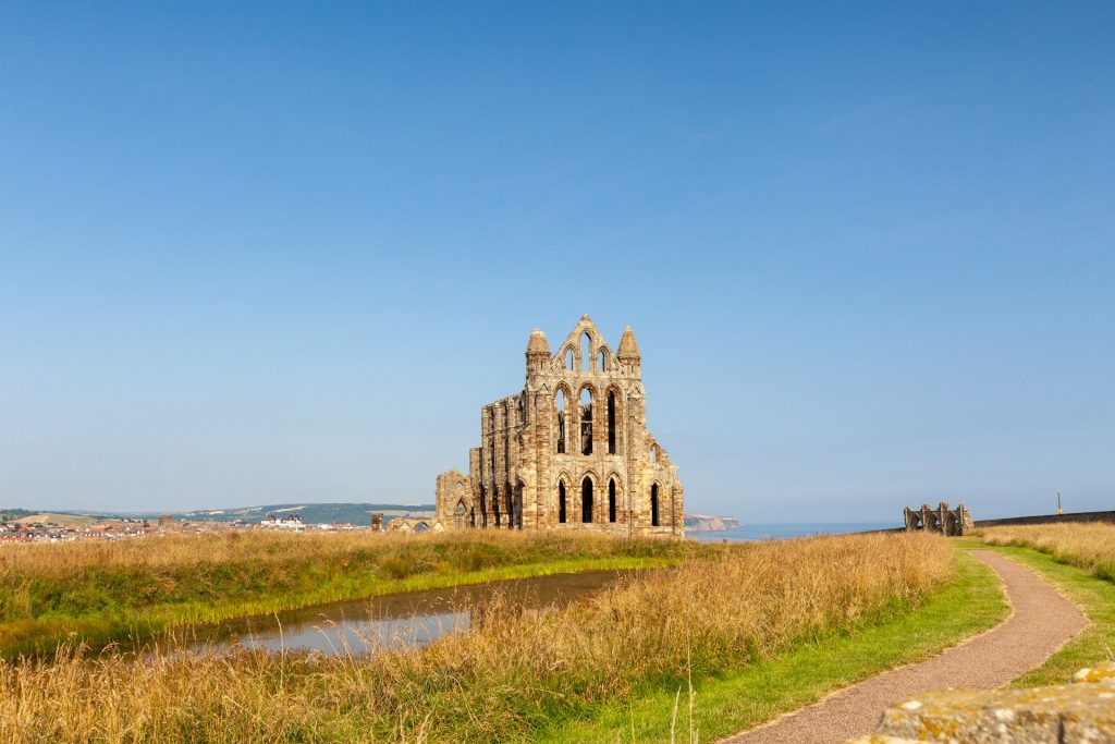 The Whitby Abbey rising up next to the Cleveland Way, Yorkshire, UK.