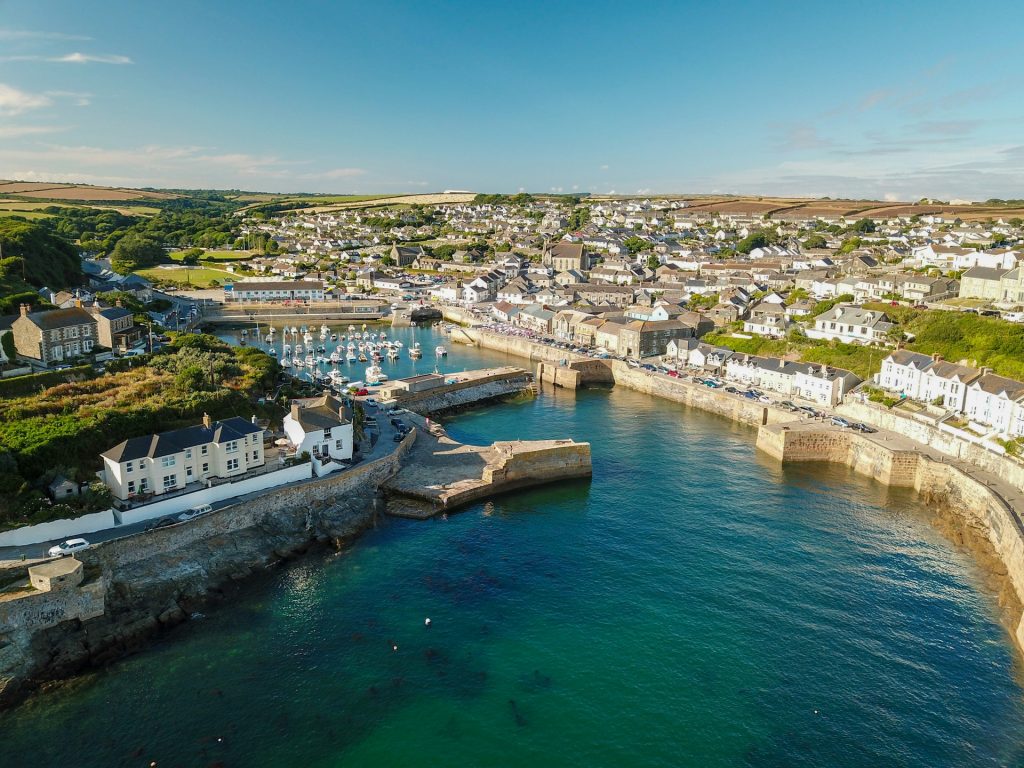 Picturesque view of Porthleven harbour on a sunny day.