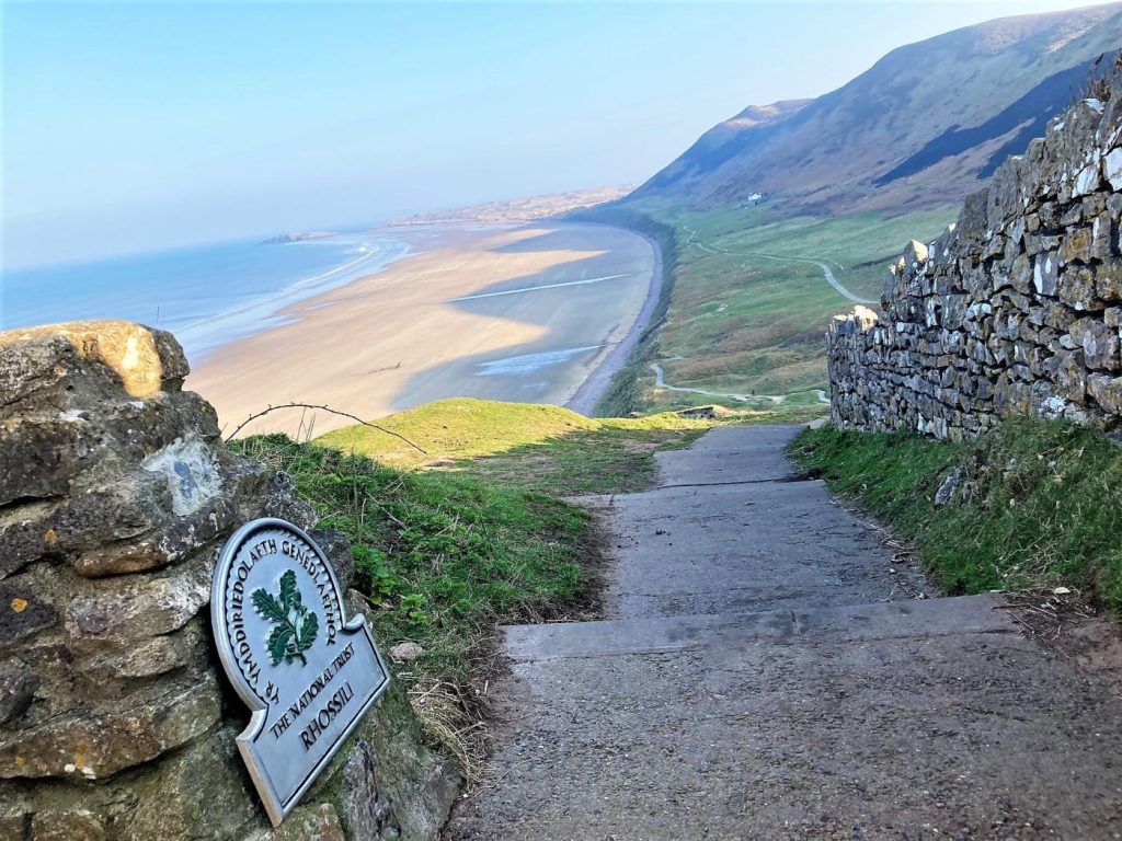 The path leading down to Rhossili Bay with the coast paths in the distance.