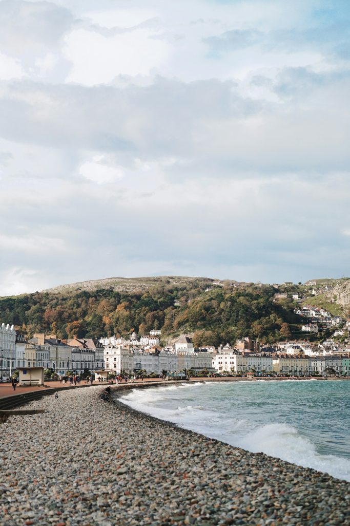 Looking along the pebble beach at Llandudno foreshore.