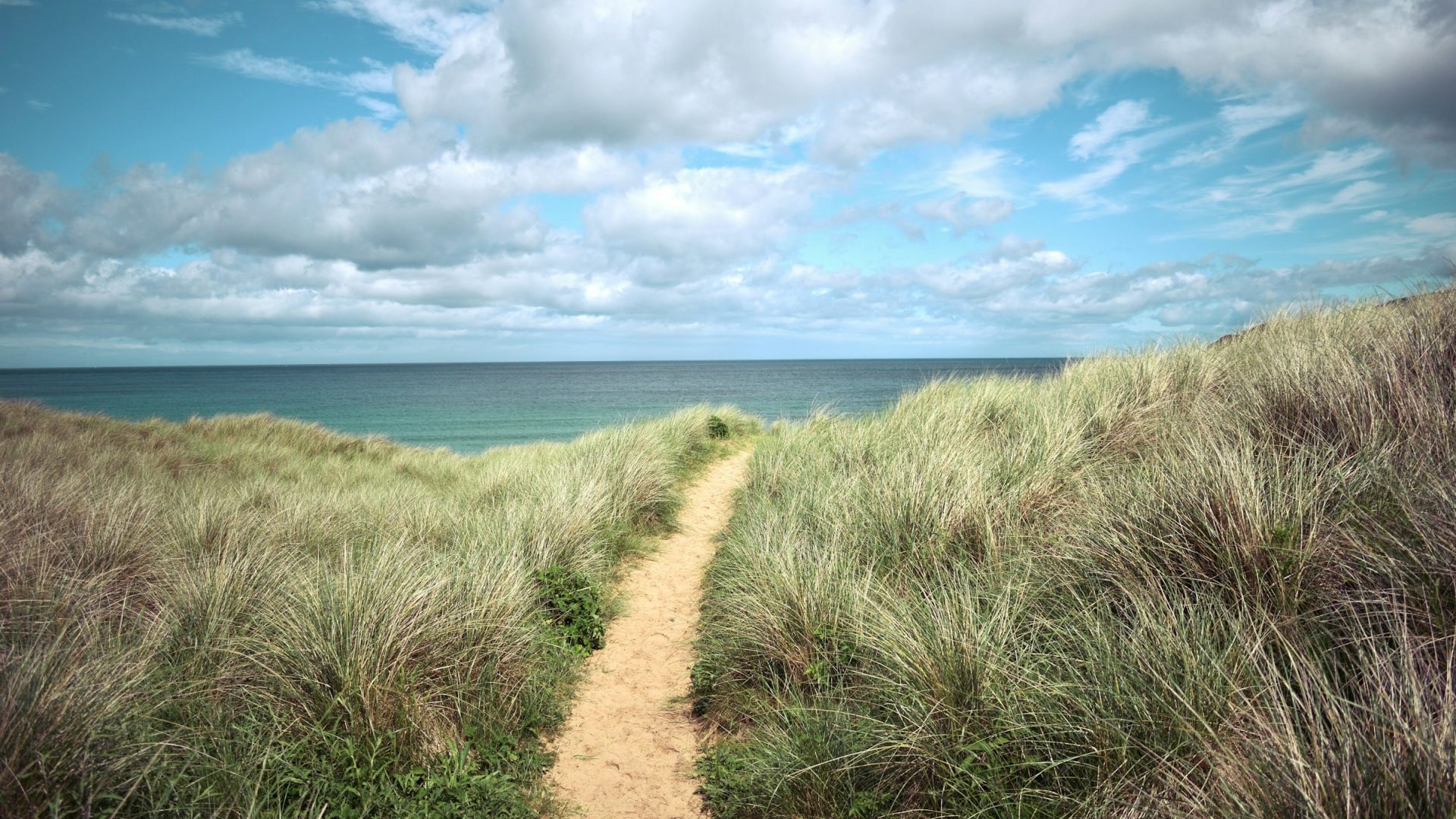 Coastal path through the grassy hills in Melvich, Scottish Highlands, UK.